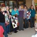 Quilts and funds exchanged in good causes – Guild gives tactile quilts to long-term care residents