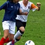 Kauffman girls playing soccer in Summer Games